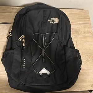 The North Face Jester Backpack 29L in TNF Black/Burnt Copper Metallic